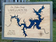 a wooden sign showing the location of lake x - house