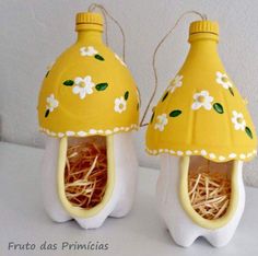 two yellow and white egg shells with flowers on them