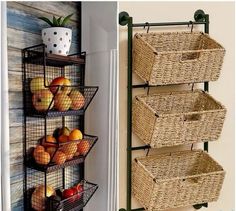 three baskets are hanging on the wall next to a shelf with apples and oranges