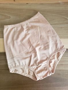 This is a vintage, unworn, Magic Lady, panty girdle, but it is light control. It is a size medium/size 6. It's color is beige. There is a light marks and a flaw in the garment. However this was due to how it was made and not to damage. The tag is marked irregular. You can see this in the images. The price reflects this. The measurements are as follows: (All measurements taken flat.) Waist: 8 to 12.5 inches Length: 13.5 inches Hips: 13.5 to 18 inches Leg opening: 8 to 10 inches http://www.etsy.co Helen Reddy, Panty Girdle, Panty Style, There Is A Light, Light Control, Boho Shorts, Medium Size, 1960s, Mid Century