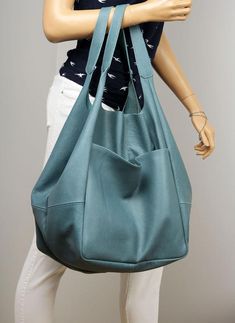 Blue Oversized leather bag, very large soft handbag, Height: 39 cm / 15.3"Height from top of handle to base: 68 cm / 26.8"Handle drop: 26 cm / 10.2"Width: 34 - 74 cm / 13.4" - 29.1"Depth: 28 cm / 11"- Large, very roomy bag made of soft distressed leather. - Unlined- Inside two spacious section.- Top closure magnet for security.Add this gorgeous bag to your collection!!To return to my shop, simply click here:  https://www.etsy.com/shop/BarbaraLeatherDesign***************************************** Blue Large Capacity Weekender Tote Bag, Leather Hobo Bag With Pockets For Errands, Blue Soft Leather Hobo Shoulder Bag, Blue Soft Leather Hobo Bag For Travel, Blue Soft Leather Hobo Bag For Everyday, Blue Leather Hobo Bag With Large Capacity, Blue Leather Weekender Bag For Everyday Use, Blue Leather Hobo Bag For Errands, Blue Leather Weekender Bag With Large Capacity