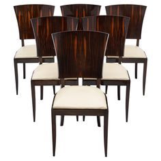 a set of six dining chairs with upholstered backrests