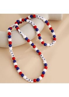 two red, white and blue beaded bracelets with the word love on them