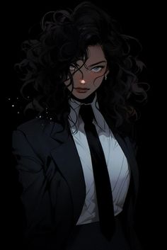 a woman wearing a suit and tie in the dark