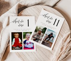 two wedding save the dates cards sitting on top of a wooden plate