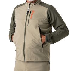 a man wearing a jacket with an orange logo on it