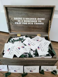 a wooden box filled with lots of cards and some writing on the inside that says bring a soldier home as a reminder to pray for our troops