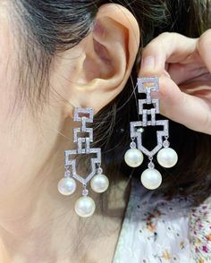 We are presenting you a HUGE pair of ONE OF A KIND, CHANDELIER, Genuine, CLASSIC WHITE South Sea Pearls, extremely FINE AA+, LUSTROUS and Rare! Accenting the 6 pearls are 144 pieces of E/VS Natural diamonds, weighting a total of 1.64 carats. Set in fabulously designed 18K solid white gold earrings! TIMELESSLY CLASSIC! WITH GORGEOUS Art Deco DESIGN. ONLY ONE ITEM AVAILABLE!! NO DUPLICATES!! WHAT YOU SEE IN THE PICTURES IS WHAT YOU WILL GET SOLIDLY HANDCRAFTED EARRINGS! SUGGESTED RETAIL VALUE: $10 Luxury Chandelier Earrings With Diamond Accents For Anniversary, Luxury Diamond White Chandelier Earrings, Luxury Chandelier Earrings For Formal Occasions, Luxury Diamond White Chandelier Earrings With Elegant Design, Luxury White Gold Chandelier Earrings With Elegant Design, Luxury Chandelier Earrings In Diamond White With Elegant Design, Luxury White Gold Chandelier Earrings For Formal Occasions, Luxury Chandelier Earrings For Anniversary, Luxury Diamond Pearl Earrings For Wedding