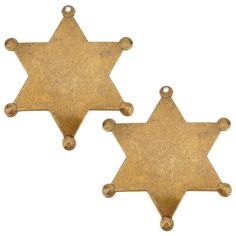 two brass star shaped charms with holes on each side, set against a white background