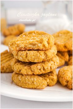 cookies stacked on top of each other on a white plate