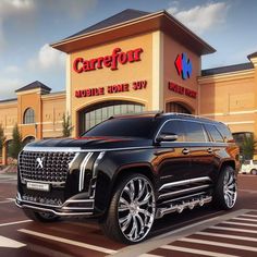 a black suv is parked in front of a large store with the name carrefour on it