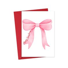 a greeting card with a pink bow on the front, and congratulations written in red ink