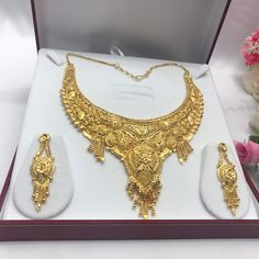 "Handmade Indian Bridal Wedding Jewelry 22ct Heavy Gold Plated Necklace Set with Earrings Indian Jewelry Indian Bollywood Jewelry , its Artificial Jewelry  Type :22ct Gold Plated Necklace Set Earrings Length: 2\"inches Approx Shape - As Shown in Picture It is a perfect match with formal attire on special occasions or with casual wearing Comes in Jewellery Gift Box Traditional Indian Wedding Jewellery Slight Colour variations possible due to difference in screen and photograph Care instructions K 22k Yellow Gold Temple Necklace For Wedding, Wedding 22k Yellow Gold Temple Necklace, 22k Yellow Gold Wedding Jewelry, Ceremonial Yellow Gold Hand Set Jewelry Sets, Ceremonial Yellow Gold Jewelry Sets, Heavy 22k Yellow Gold Jewelry Sets, Traditional Gold Necklace For Marriage, Ceremonial Gold-plated Jewelry Sets With Intricate Design, 22k Gold Bridal Necklace For Anniversary