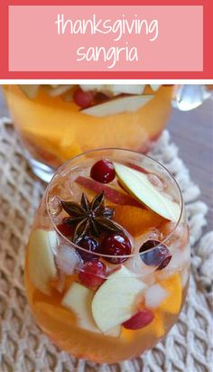 an image of thanksgiving sangria with apples, cranberries and apple slices in it