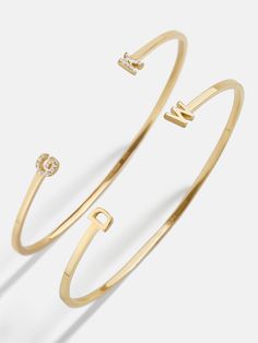 Our 18K Gold Double Initial Custom Cuff Bracelet is an updated take on a classic initial accessory. Available in an all-gold and a subtle sparkly version, these bracelets are ones you'll have for years to come. Add your own initials or that of you and a loved one to create a keepsake you'll cherish. Not to mention, thi Initials Bracelet, Nameplate Necklace Gold, Nameplate Bracelet, Custom Cuff Bracelet, Gold Medallion Necklace, Ups Shipping, 18k Gold Earrings, Gold Bead Bracelets, Gold Bracelet Cuff