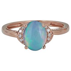 an opal and diamond ring in rose gold