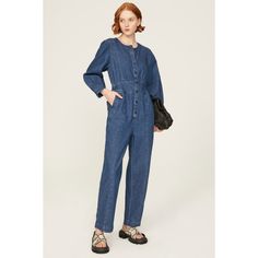 Blue denim (76% Cotton, 21% Hemp, 3% Elastane). Jumpsuit. Long sleeves. Crewneck. 29" inseam. 12" rise. Imported. Relaxed Fit Long Sleeve Denim Jumpsuit, Denim Blue Workwear Jumpsuits And Rompers With Button Closure, High Rise Cotton Denim Jumpsuit For Work, Relaxed Fit Jeans Overall For Work, Workwear High Rise Denim Jumpsuit With Button Closure, Denim Blue Button-up Jumpsuit For Work, Dark Wash Straight Leg Jumpsuits For Workwear, Workwear Denim Jumpsuit With Button Closure, Blue Denim Jumpsuit With Relaxed Fit And Long Sleeves