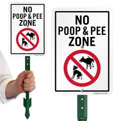 there are two signs that say no poop and pee in front of each other