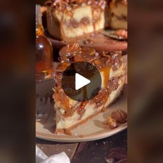 a piece of cheesecake with caramel sauce and pecans on the side, sitting on a plate