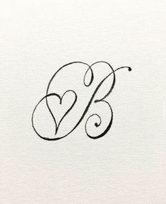 the letter b is written in cursive writing and has a heart on it