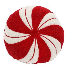 a red and white peppermink pillow on a white background