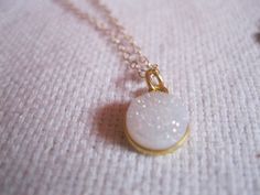 Cute white druzy necklaceSo sparkly !Dainty and delicatePerfect for everyday wear Only 8mm ! Choose chain length at checkoutTo pair this necklace up with the matching bracelet, click on the link belowhttps://www.etsy.com/listing/221488682/white-druzy-bracelet-white-druzy-jewelryTo see more DRUZY NECKLACES, click on the link belowhttps://www.etsy.com/shop/TinyRosesJewelry?section_id=16187427&ref=shopsection_leftnav_6 White Round Pendant Necklace For Party, White Glitter Jewelry As Gift, White Glitter Jewelry Gift, White Glitter Jewelry For Gifts, Roses Jewelry, Sparkly Necklace, Druzy Bracelet, Jewel Wedding, Druzy Jewelry