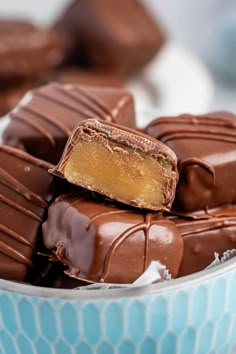 a bowl filled with chocolate covered pieces of cake