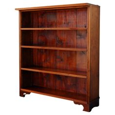 a wooden bookcase with three shelves on one side and two drawers on the other