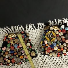 there are two pieces of art made out of buttons