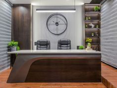 an office with a large clock on the wall