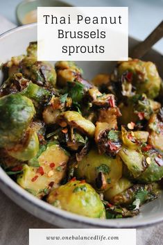 a white bowl filled with brussel sprouts on top of a table