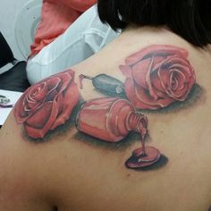 a woman with a rose tattoo on her back