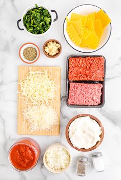 ingredients to make an italian meatball recipe laid out on a marble counter top