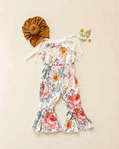 This adorable jumpsuit will be a staple in your daughter's closet. Pair with some sunnies for the perfect outfit. Soft Cotton Material Bell Bottom Style Tie Straps for flexibility in sizing Floral Jumpsuit, Bell Bottom, Bell Bottoms, Perfect Outfit, Cotton Material, Sunnies, Jumpsuit, Floral, Closet