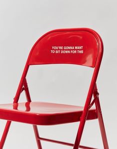 a red folding chair with the words you're going want to sit down for this