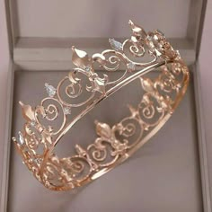 a gold tiara is sitting in a box