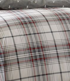 the comforter is made up with plaid sheets