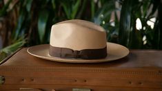 Crown: 4" Brim: 3" Hatband: 1-1/4" dark brown Color: light brown Ready to wear Luxury Brown Panama Hat For Travel, Luxury Wide Brim Men's Fedora, Luxury Brown Men's Fedora, Luxury Brown Panama Hat For Men, Luxury Classic Men's Fedora, Cheap Brown Fedora For Vacation, Luxury Brown Fedora For Country Events, Luxury Western Style Men's Panama Hat, Luxury Solid Color Men's Fedora