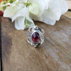 NOTE : WE USED NATURAL GEMSTONES , SO STONE  MAY BE LITTLE DIFFERENT .This  is a listing  of Boho sterling silver ring # metal = sterling silver  925 # Gemstone  - Garnet# Ring Size - Available in all Size # Stone Color - Purple# Stone Shape - OvalHandmade Crafting bohemian Ring - This style has bohemian style . it will look beautiful when you wear it ..Thanks for visiting our shop ...  favorite our shop for daily updates ... Boho Statement Ring, Garnet Ring Silver, Sterling Silver Garnet Ring, Lapis Pendant, Bohemian Ring, Ring Hand, Rose Quartz Ring, Bohemian Rings, Black Onyx Ring