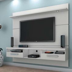 an entertainment center with a flat screen tv mounted on the wall