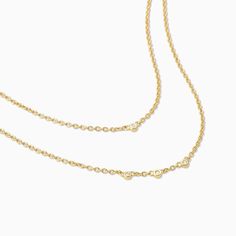 Add some gold layers to your look with our Layered Chain Vermeil Necklace. Crafted from 18k gold over sterling silver, this pre-layered necklace is an effortless, yet still elevated piece every jewelry collection needs. Did we mention it also has real, slightly included round-cut diamonds? Now you really need this gold necklace. Sterling Silver Double Strand Necklace For Layering, Dainty Yellow Gold Double Chain Jewelry, Timeless Gold Jewelry For Layering, Elegant Gold-plated Double Chain Charm Necklaces, Yellow Gold Double Chain Charm Necklace, Elegant Double Strand Layered Necklace With Satellite Chain, Classic Double Strand Necklaces For Layering, Classic Double Strand Necklace For Layering, Yellow Gold Cable Chain Charm Necklace For Layering