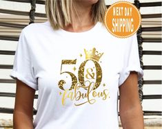 a woman wearing a t - shirt that says 90 and fabulous with gold glitter on it