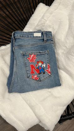 Make a statement with a pair of hand painted jeans! Whether you are heading to a football game or a sorority event, everyone will love these!  Please send me a message with your design ideas and any images you would like me to go off of! Final delivery of the jeans will also depend on the design and shipping. **Price includes paint supplies, my time, and skill. you must supply your own jeans to ensure the correct sizing and style! If you would like to add jewels, pearls, charms, etc. I can definitely do that, however it may include an additional charge depending on design and quantity. After purchasing the listing, we will correspond via Etsy messenger as to the design specifics (what design you would like, style of jacket you want, size, and placement of designs). No refunds will be accep Football Jeans, Painted Denim Jeans, Hand Painted Jeans, Football Girlfriend, Jeans Western, Sorority Events, Painted Jeans, Custom Football, Go Off