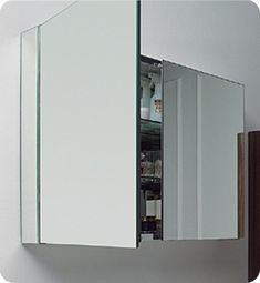 an open medicine cabinet in the corner of a room