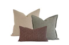 three pillows in various colors and patterns