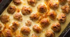 a casserole dish with meatballs and cheese on top, ready to be eaten