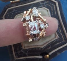 Stunning 14k Yellow Gold approximately 1ct Emerald Cut Diamond VS, GH and Marquise cut Diamond and round Ring...Custom made...Look Spectacular...Antique Box for Display Only.Some pics ENLARGED to see details.Weight is 11.3 Grams approximately.Size 6 1/2, sizable.. Unique Multi-stone Diamond Ring For Anniversary, Anniversary Multi-stone Emerald Cut Diamond Ring, Emerald Cut Multi-stone Diamond Wedding Ring, Unique Cluster Diamond Jewelry, Unique Diamond Cluster Jewelry, Unique Multi-stone Diamond Wedding Ring, Heirloom Ring, Aquamarine Wedding, Heirloom Rings