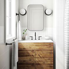 a bathroom with a sink, mirror and towel rack on the wall next to it