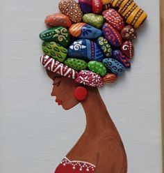 a painting of a woman's head with colorful beads on it