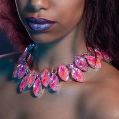 Bohemia Pink Crystal Necklace – a captivating accessory that effortlessly combines free-spirited style with a touch of elegance. This necklace is a celebration of individuality and artistic expression, perfect for those who seek to make a statement in their accessories. The necklace features a stunning arrangement of pink crystals, carefully chosen for their vibrant hues and ethereal beauty. The Bohemian aesthetic is further enhanced by the eclectic mix of shapes and sizes, creating a piece that Unique Party Choker Jewelry, Bohemian Clavicle Chain Necklaces For Party, Eye-catching Gold Jewelry For Party, Glamorous Silver Necklace For Festivals, Unique Pendant Choker For Party, Long Clavicle Necklace For Party, Long Clavicle Chain Necklace For Party, Adjustable Costume Crystal Necklaces For Party, Party Long Necklace Clavicle Chain